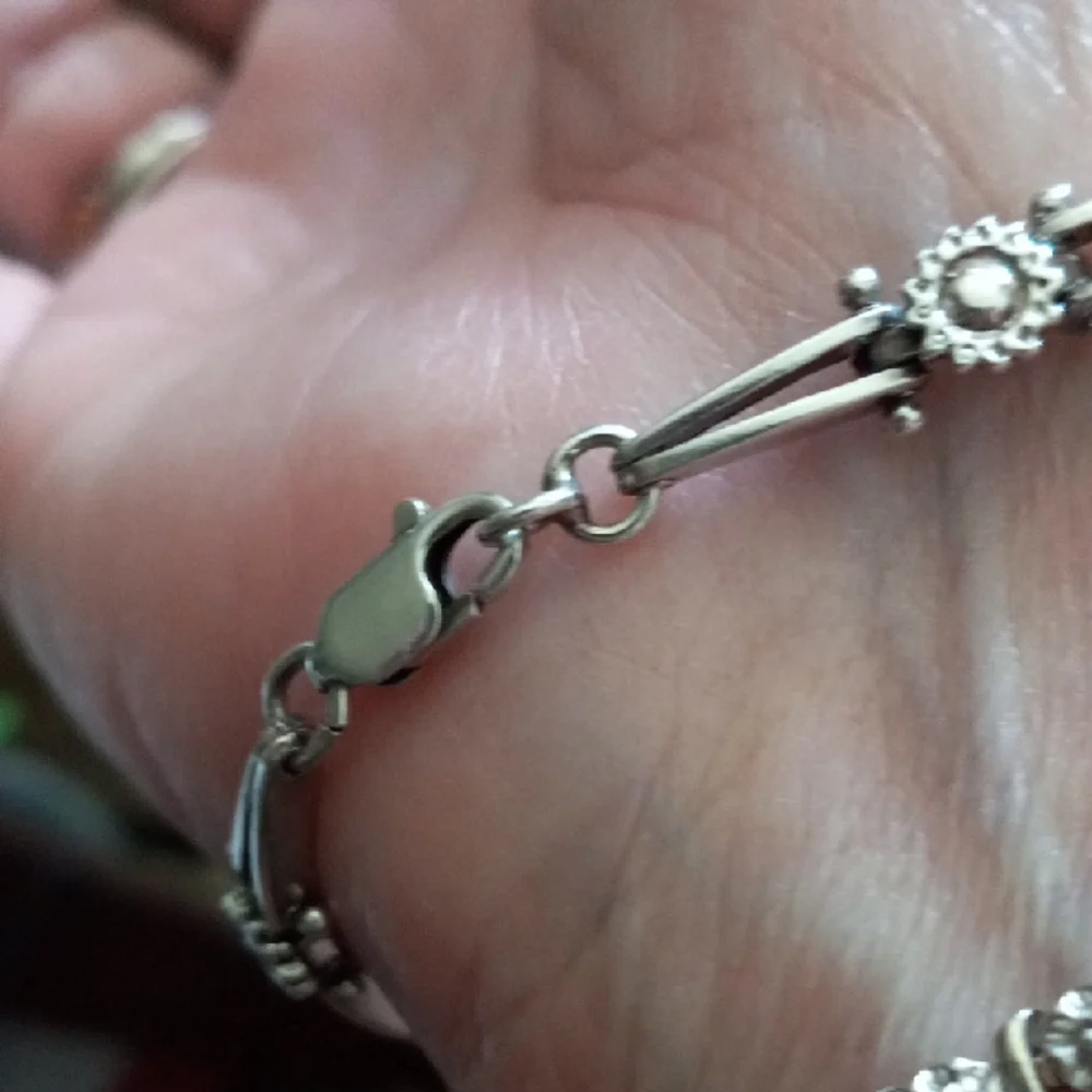 Elegant Silver Bracelet with Floral Accents